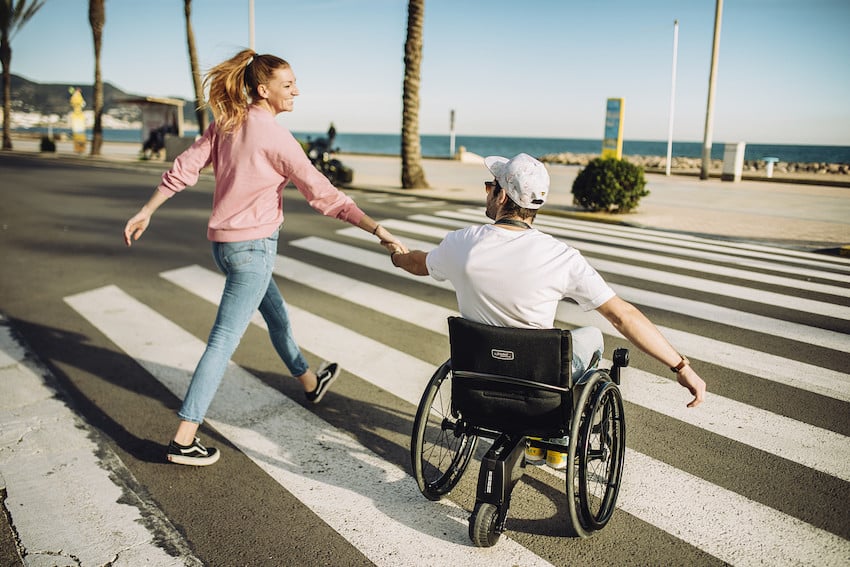 couple adheres to Australian road rules for mobility scooters and wheelchairs while out and about