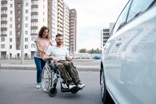 couple try out a wheelchair accessible vehicle hire car