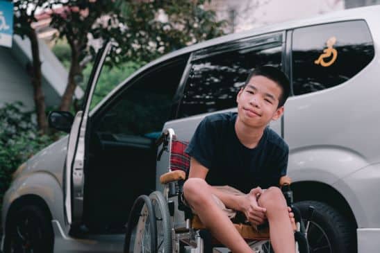Aussie kid whose parents have hired an accessible car for a holiday trip