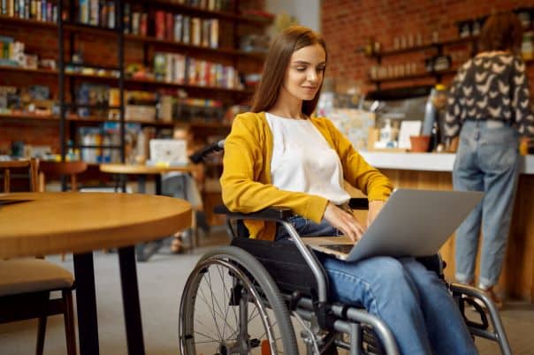 woman makes a wheelchair accessible vehicle hire booking