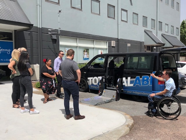 Man shows Blue Badge Insurance team Imported wheelchair vehicles option for people with disability