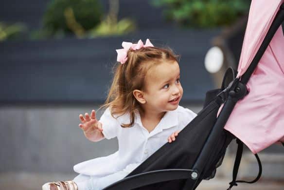 this little girl in a pram wonders whether drivers with disability can park in pram parking or seniors parking... Who can park in seniors parking?