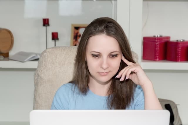 woman choosing ndis plan management option in front of laptop