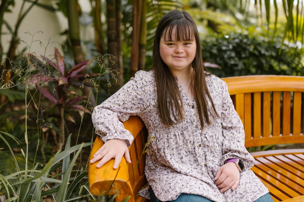 Down syndrome does cause developmental delay and learning disability.