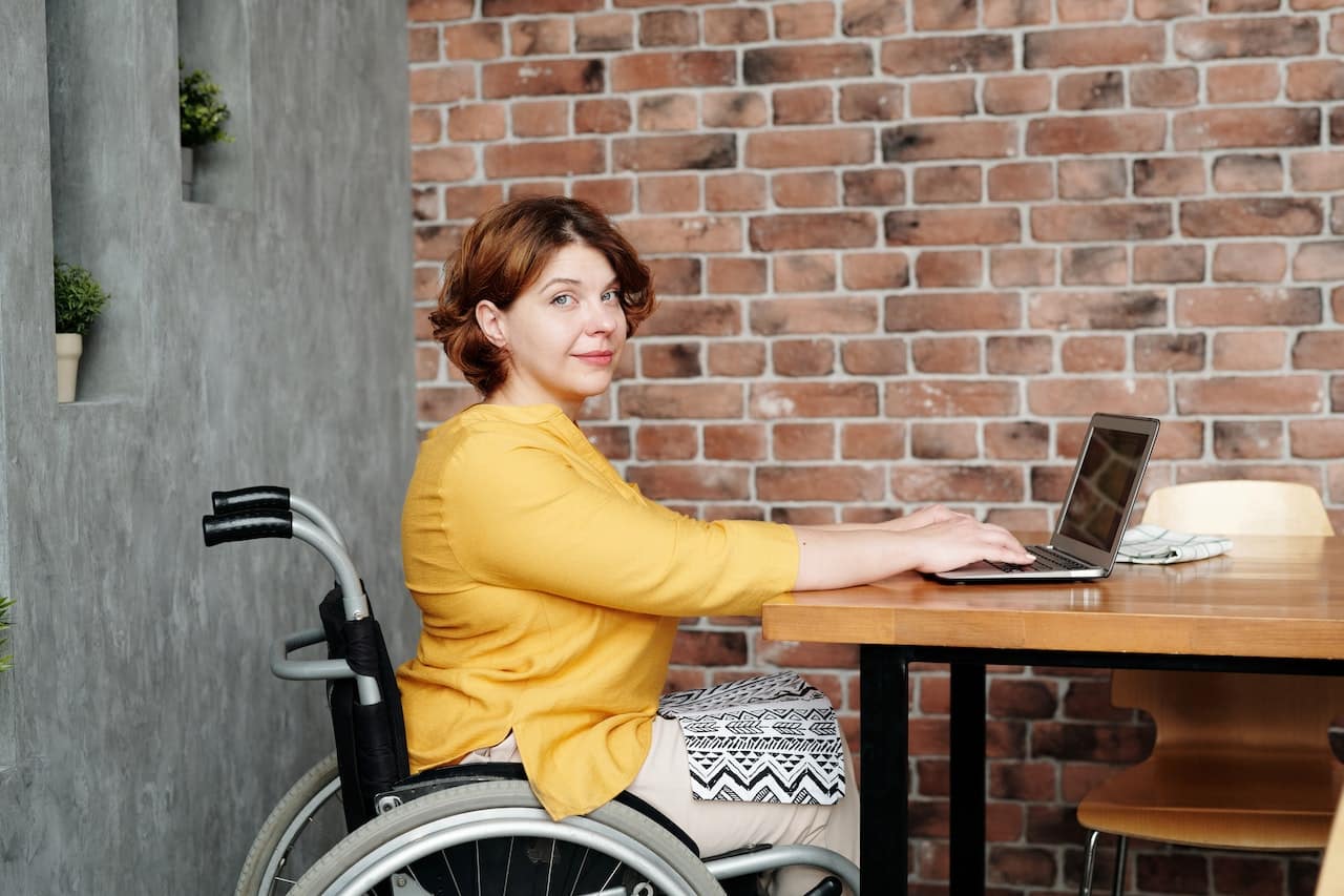 A major benefit of online learning is that the student doesn’t need to be in the same place as the teacher, like this woman studying from home.