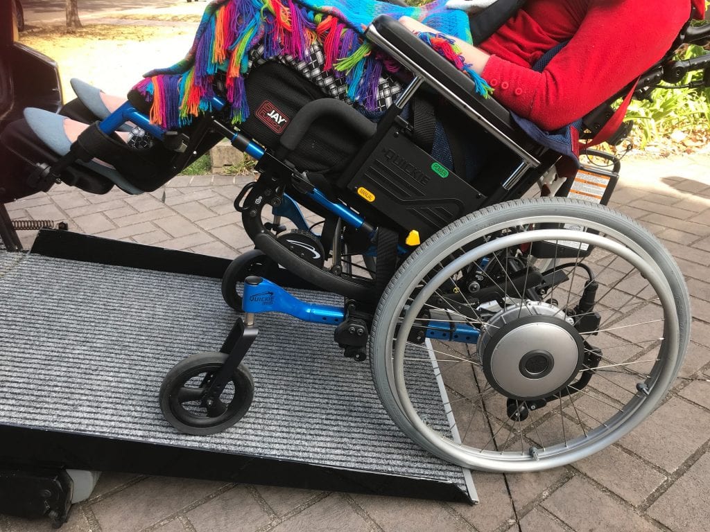 This person has chosen a wheelchair accessible car hire with a side entrance ramp. 