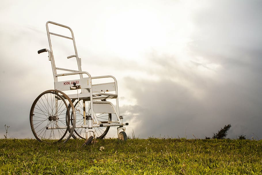 A metal wheelchair different to the first wheelchair which would probably be wooden.