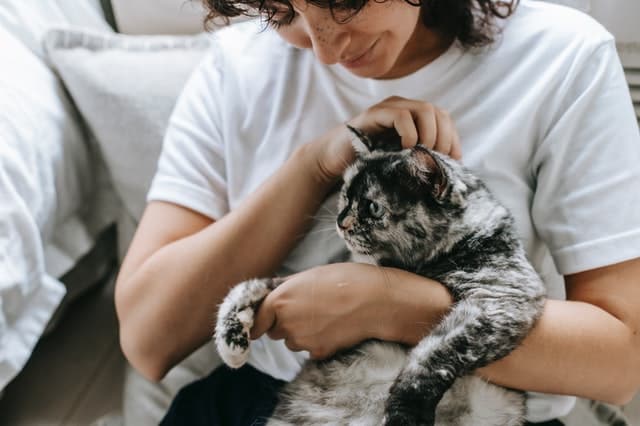 woman experiences physical benefits of owning a pet