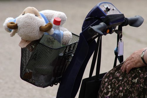 close up of shopping cart in folding mobility scooter