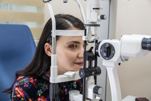 eye tests like this woman is having can help to detect glaucoma early