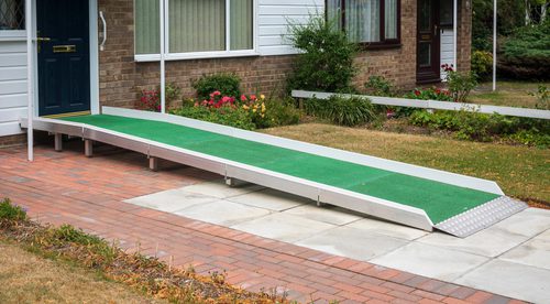 semi-permanent wheelchair ramp outside a home