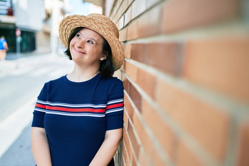 adult woman in hat with down syndrome