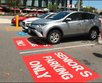 A designated seniors parking is taken up by a senior who wonders who can park in seniors parking 