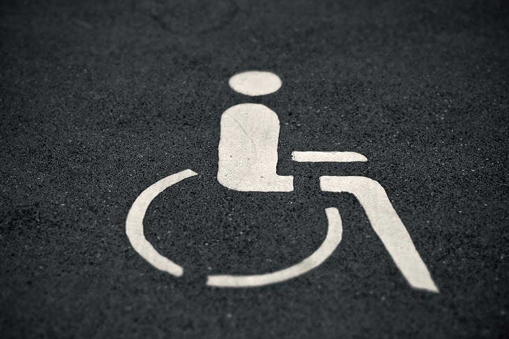 This black and white US accessible parking symbol is an example of many around the world