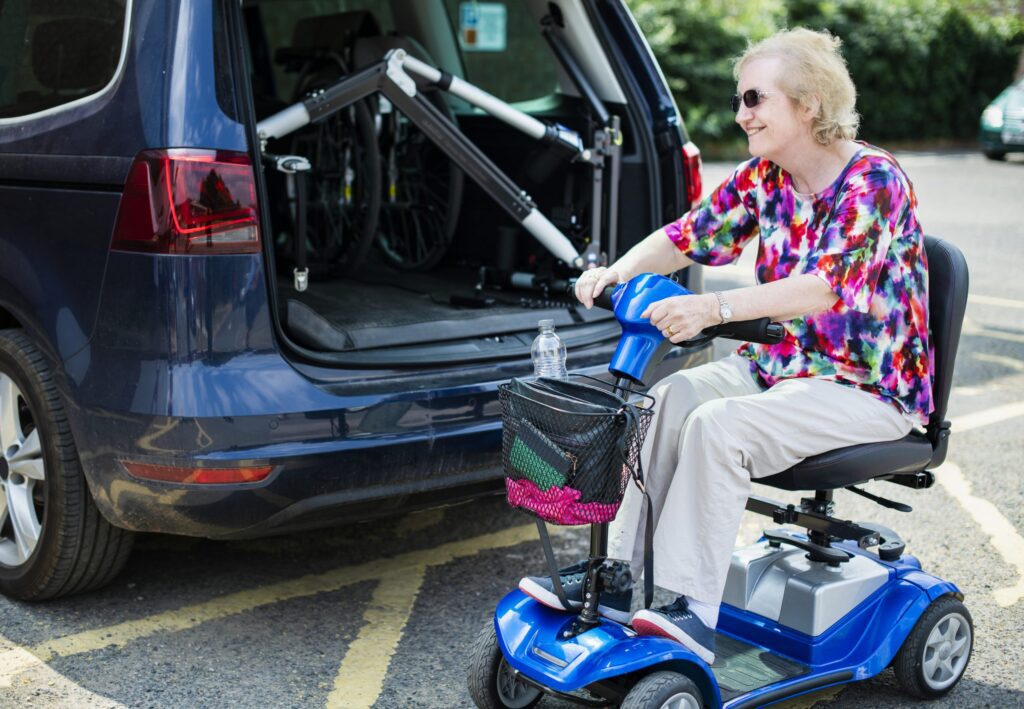 woman uses mobility scooter assistive technology in Australia