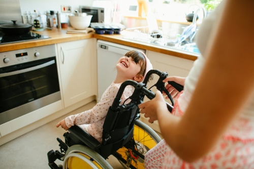 girl uses assistive technology for children