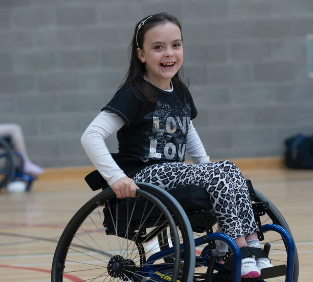 girl trials assistive technology for children as she takes part in adaptive sports