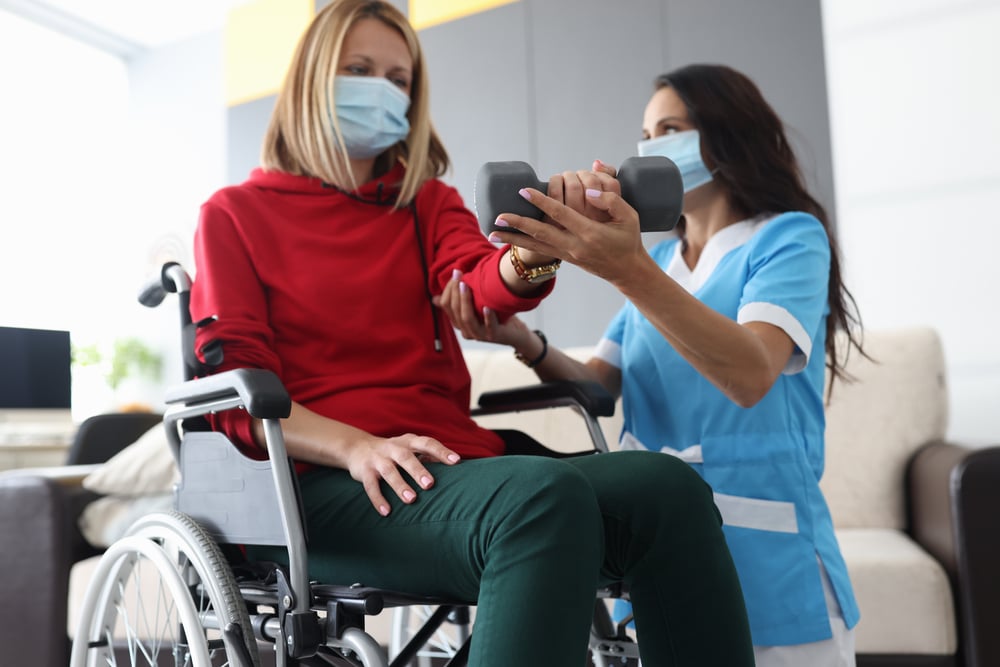 occupational therapy clinician conducts wheelchair assessment