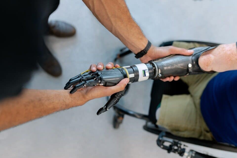 An occupational therapist works with the assistive tech supplier