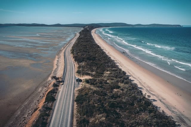 save fuel when driving on a coastal highway like this that runs next to the beach