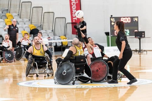 wheelchair rugby coach motivates and guides the team