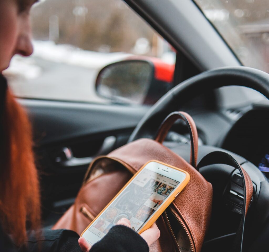 A phone like this one in a driver's hand causes distracted driving