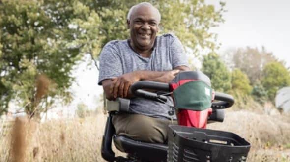 a man uses a 4 wheel mobility scooter for added balance