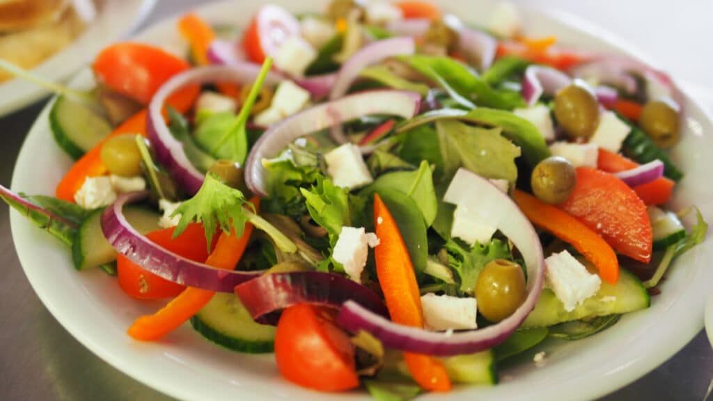 Pre-mixed salads make a good depression meal, like this vegetable salad on a plate.
