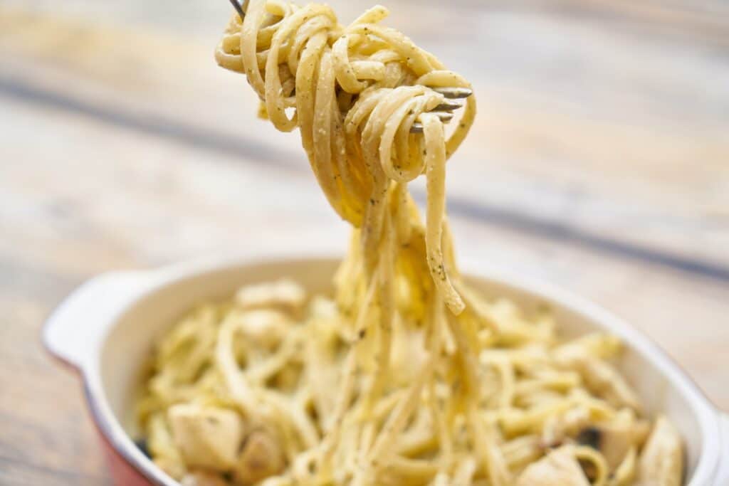 Close up of Carbonara pasta in pot which is another meal to make when depressed.