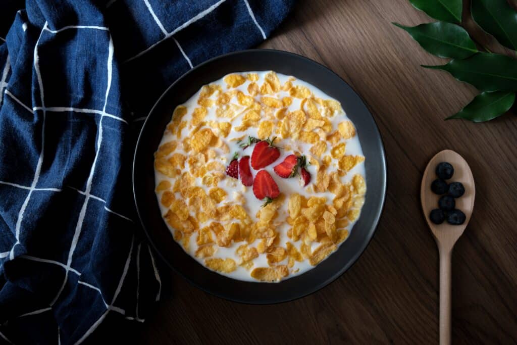 Cereal with milk and chopped strawberries is one of the easiest meals to whip up when living with chronic pain or depression. 