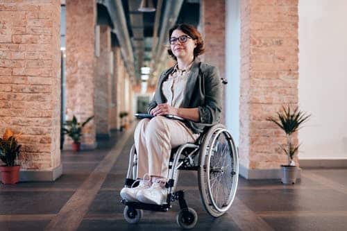 an Australian women living with a physical disability at her place of employment