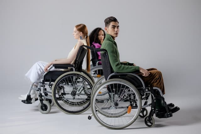 three models in wheelchair showcase inclusive adaptive clothing