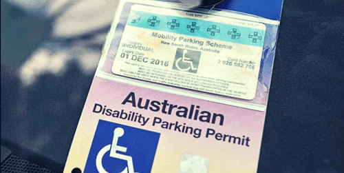 Image of an Australian disability parking permit with a blue and white design.