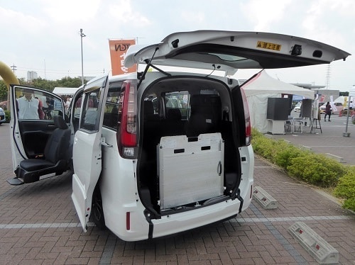 A WAV with a folded up wheelchair ramp. This may be a grey import vehicle