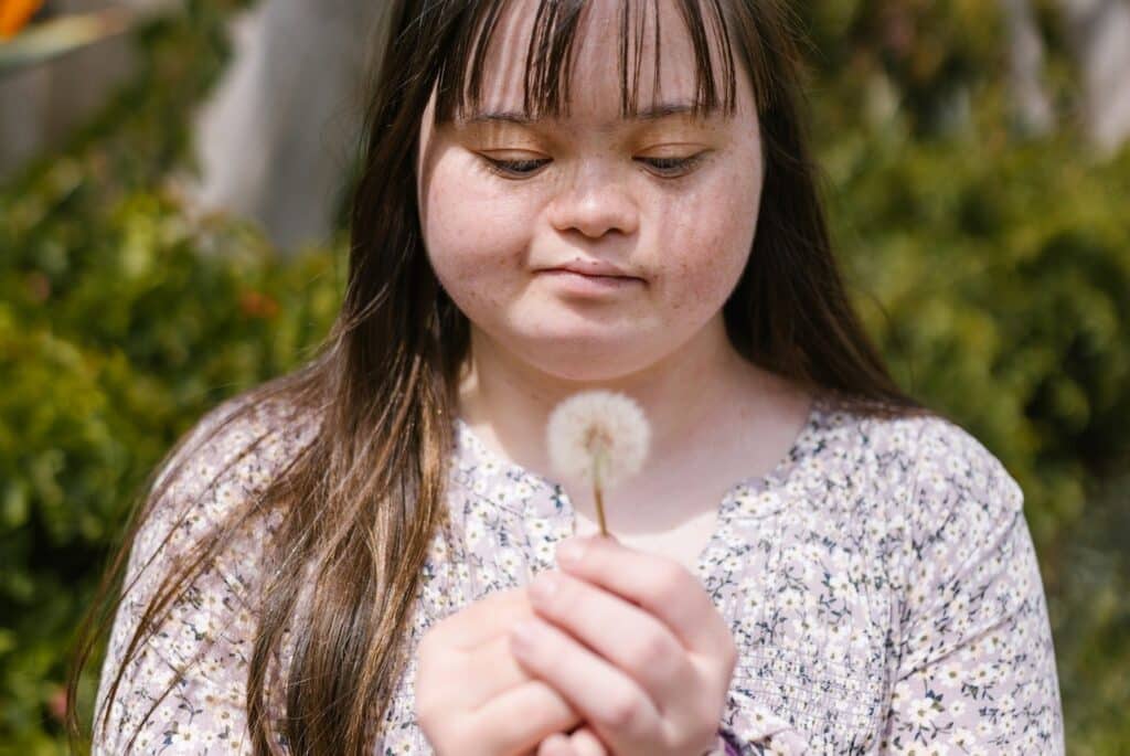 a woman with an intellectual disability attending a workshop hosted by As We Are