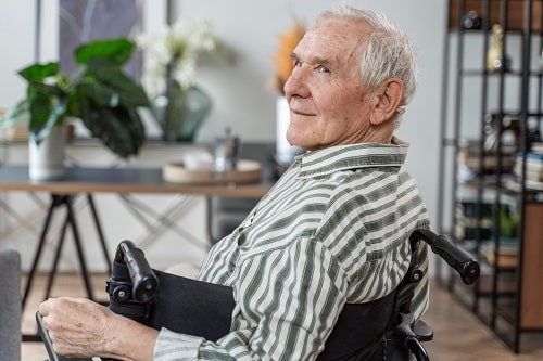 Side view senior man in wheelchair
