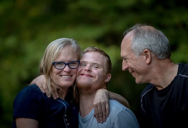 A Australian family hug each other 