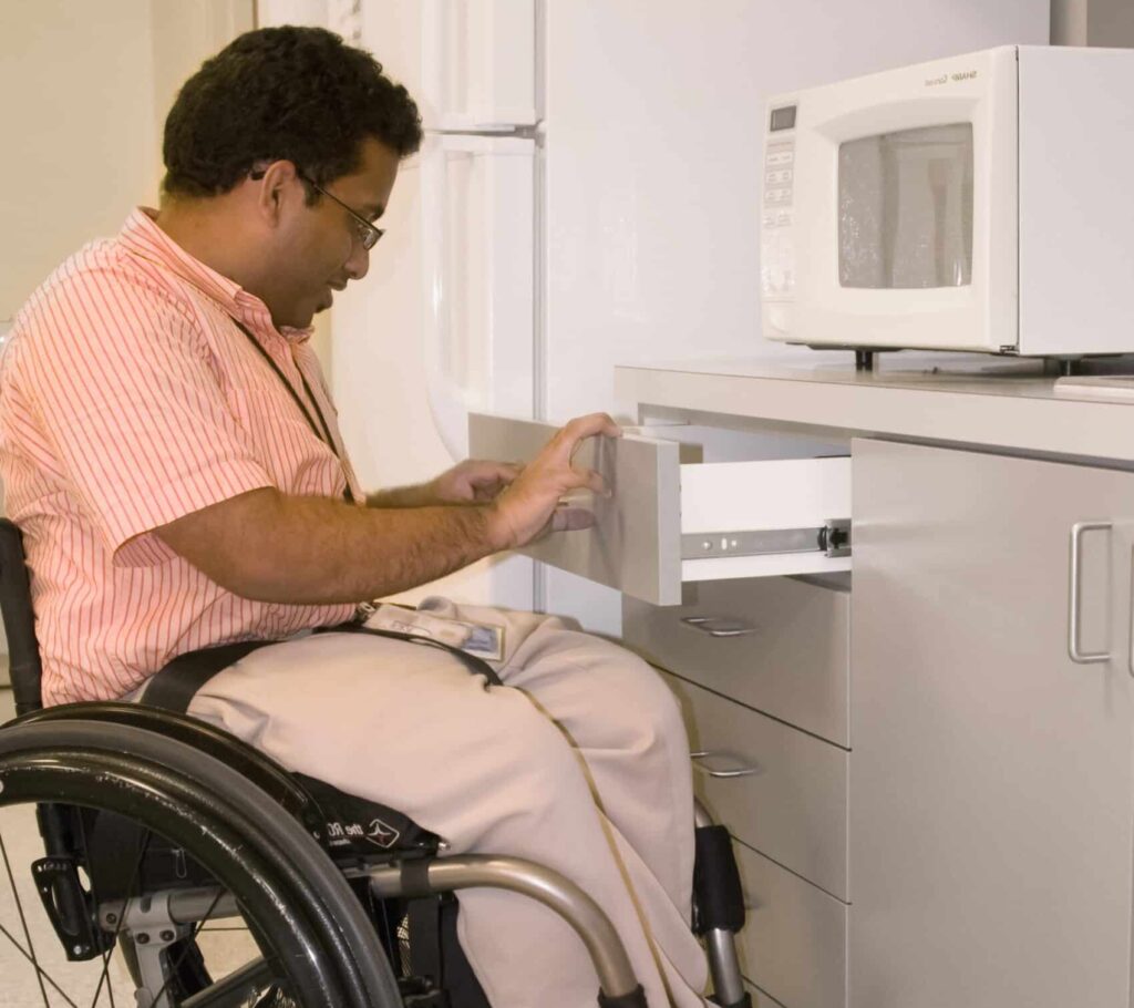 Lower height countertops or kitchen islands allow wheelchair users to comfortably access workspaces.
