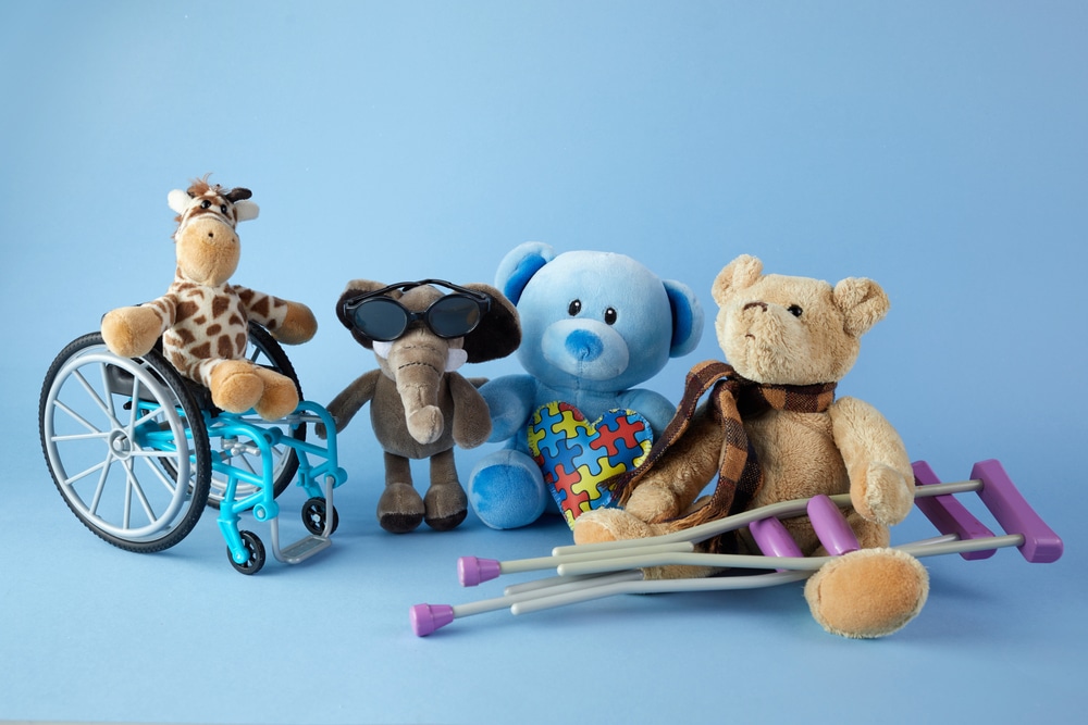 diverse dolls and disability awareness toys stand in a row helping give children with disabilities visibility