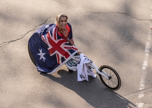 New York, NY - November 7, 2021: Winner of 1st place of Women professional wheelchair athletes of 50th TCS NYC marathon Madison de Rozario poses at finish line in Central Park