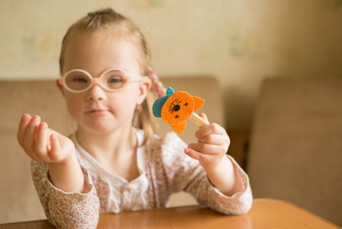 Child with disabilities is learning through play