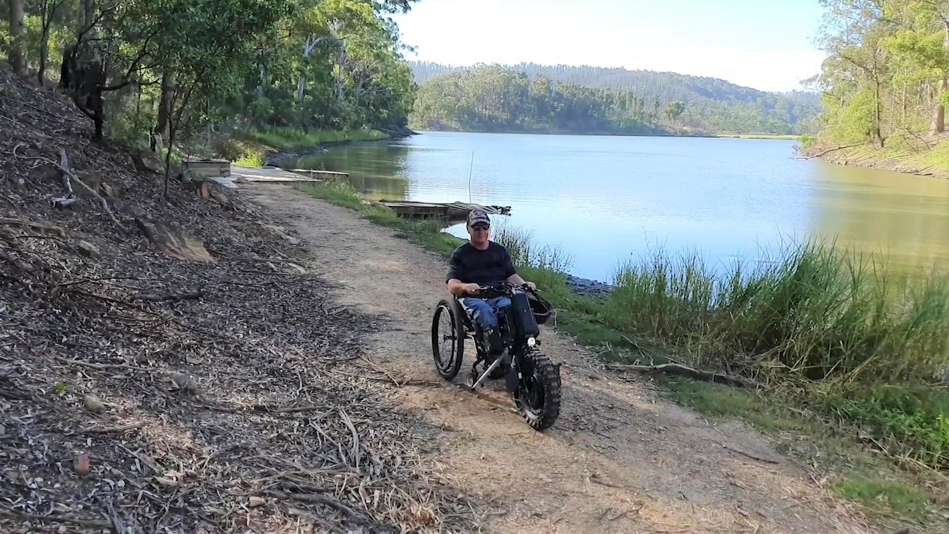Malcolm using front wheel power assist device