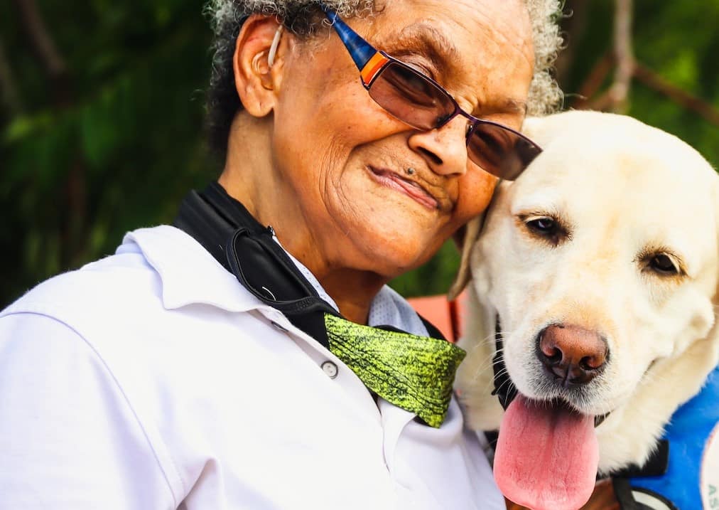 a woman who suffers from PTSD is calmed by her service dog