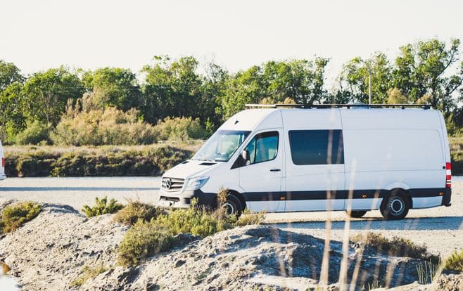 Buying a wheelchair accessible vehicle came easy to the owners of this white WAV parked next to rocks