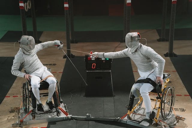 two athletes compete in wheelchair fencing