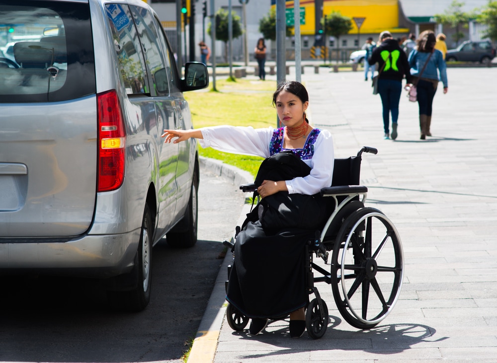 A woman who is working and studying part time gets an accessible taxi to travel between the two, using her mobility allowance to cover the travel costs