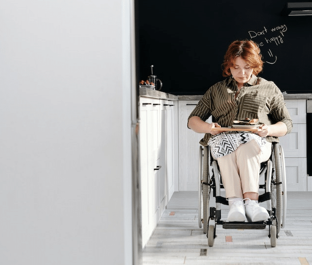 Woman Sitting on Wheelchair. She may want to read the Disability Royal Commission report