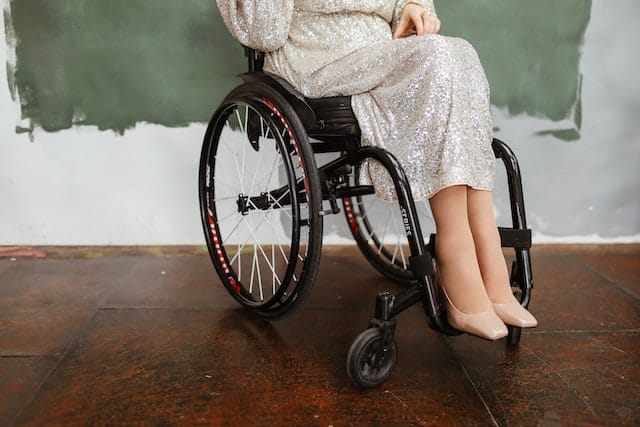 An entrepreneur disabilities who uses a wheelchair, gets dressed in her favourite smart attire to celebrate the one year anniversary of her home business.