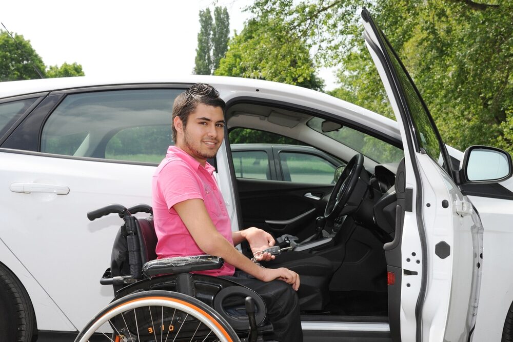 A man drives his modified car under the protection of discounted car insurance with Blue Badge Insurance