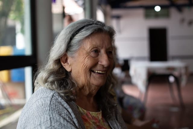 An Australian senior smiles after learning she will receive the support she needs from CHSP to continue living at home